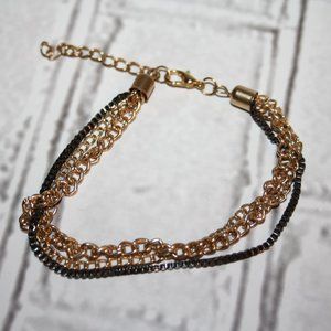 Beautiful gold and gunmetal multi-chain bracelet 8-9.5"